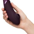 Holding Womaniser Next in hand